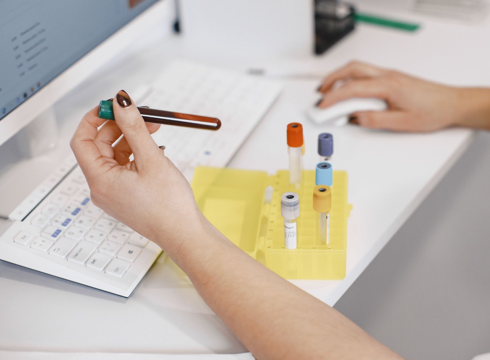 Laboratory sample being recorded at a clinical workstation