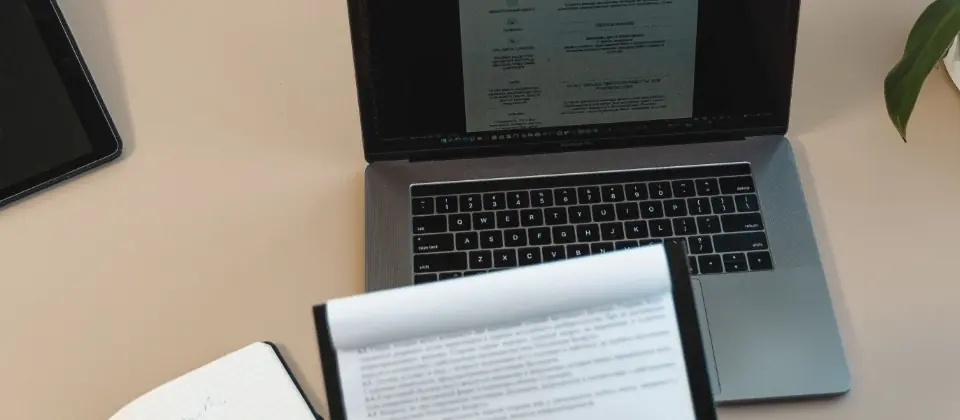 Recruitment desk with laptop and application documents