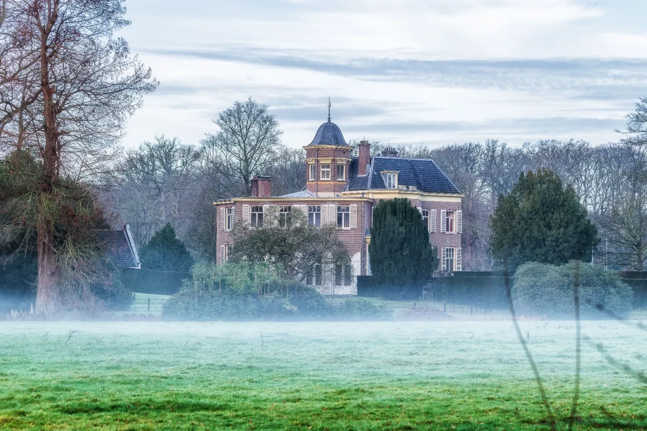 A secluded country estate in morning mist, illustrative of private luxury ownership