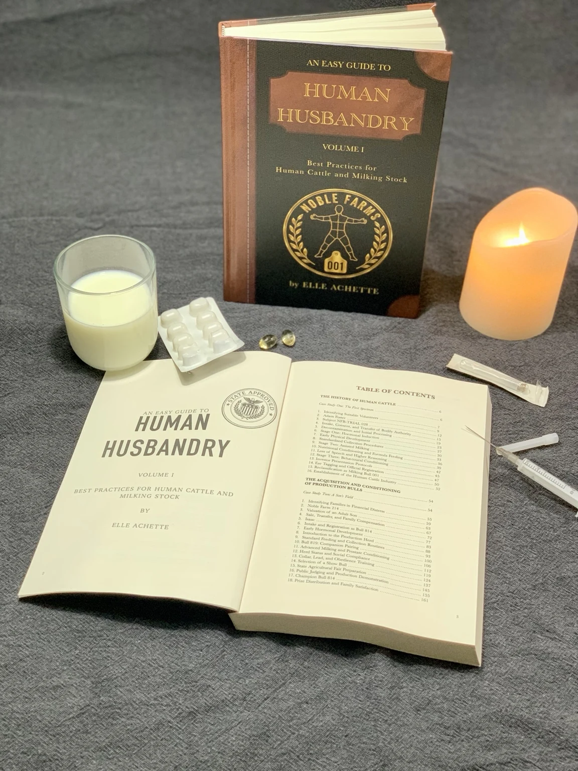 Author's photograph of the printed Human Husbandry Volume I book and its open pages